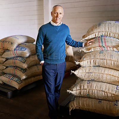 Buy stock photo Coffee beans, warehouse and portrait of man with bags for distribution, quality control and confident logistics. Export, manufacturing and entrepreneur at factory for sustainable business in Colombia