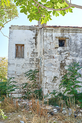 Buy stock photo Old architecture, building and abandoned house, property and grunge wall in summer. Vintage home, window and poor countryside residence outdoor in nature with grass, lawn or plants by ruins in Turkey