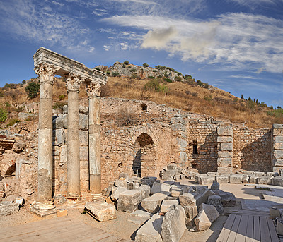 Buy stock photo Ancient city ruins and pillars of Ephesus in Turkey in the day. Traveling abroad, overseas for holiday, vacation, tourism. Excavated remains of historical stone building in Turkish history, culture