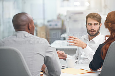 Buy stock photo Shot of coworkers having a meeting at the office
