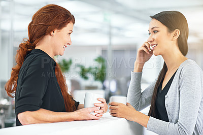 Buy stock photo Business women, coffee break and chat in office with gossip, story and news with partner. Work friends, happy and listening with drink, latte and conversation to start morning in corporate workplace