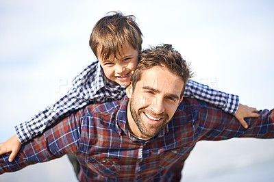 Buy stock photo Shjot of a father and son enjoying a day outdoors