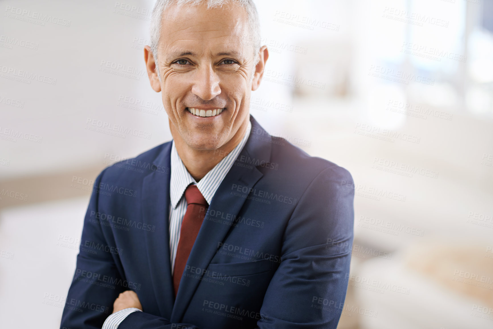 Buy stock photo Smile, portrait and mature businessman, professional or senior manager at corporate startup office. Arms crossed, confidence or happy face of business owner, boss or entrepreneur at agency with pride