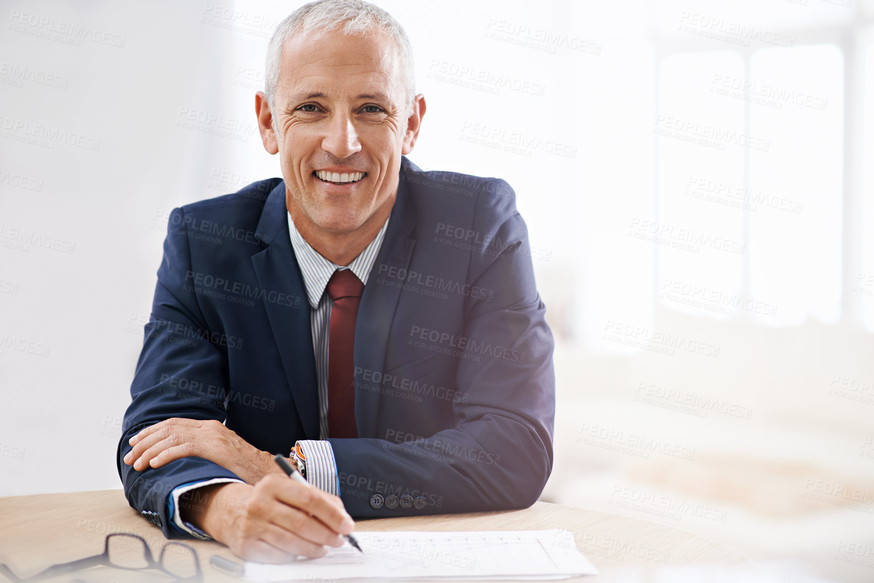 Buy stock photo Office, documents and portrait of business man with confidence for career, job and working at desk. Professional, startup agency and senior person writing notes for company pride, smile and planning