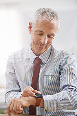 Buy stock photo Smile, tech and senior businessman with smart watch in office for message, notification or text check. Happy, reading and male executive with digital clock, schedule or effective time management