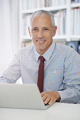 Buy stock photo Happy, portrait and senior businessman with laptop in office for social media, search or web communication. Face, smile and elderly male entrepreneur with computer for research, email or b2b network