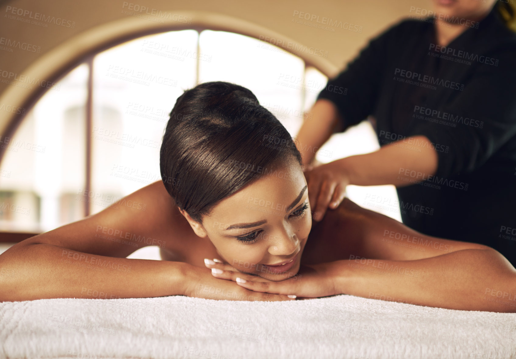 Buy stock photo Woman, massage and happy in spa for relax, recovery and wellness on vacation or weekend. Body care, zen and holistic healing in beauty salon with professional masseuse, peace and detox on holiday