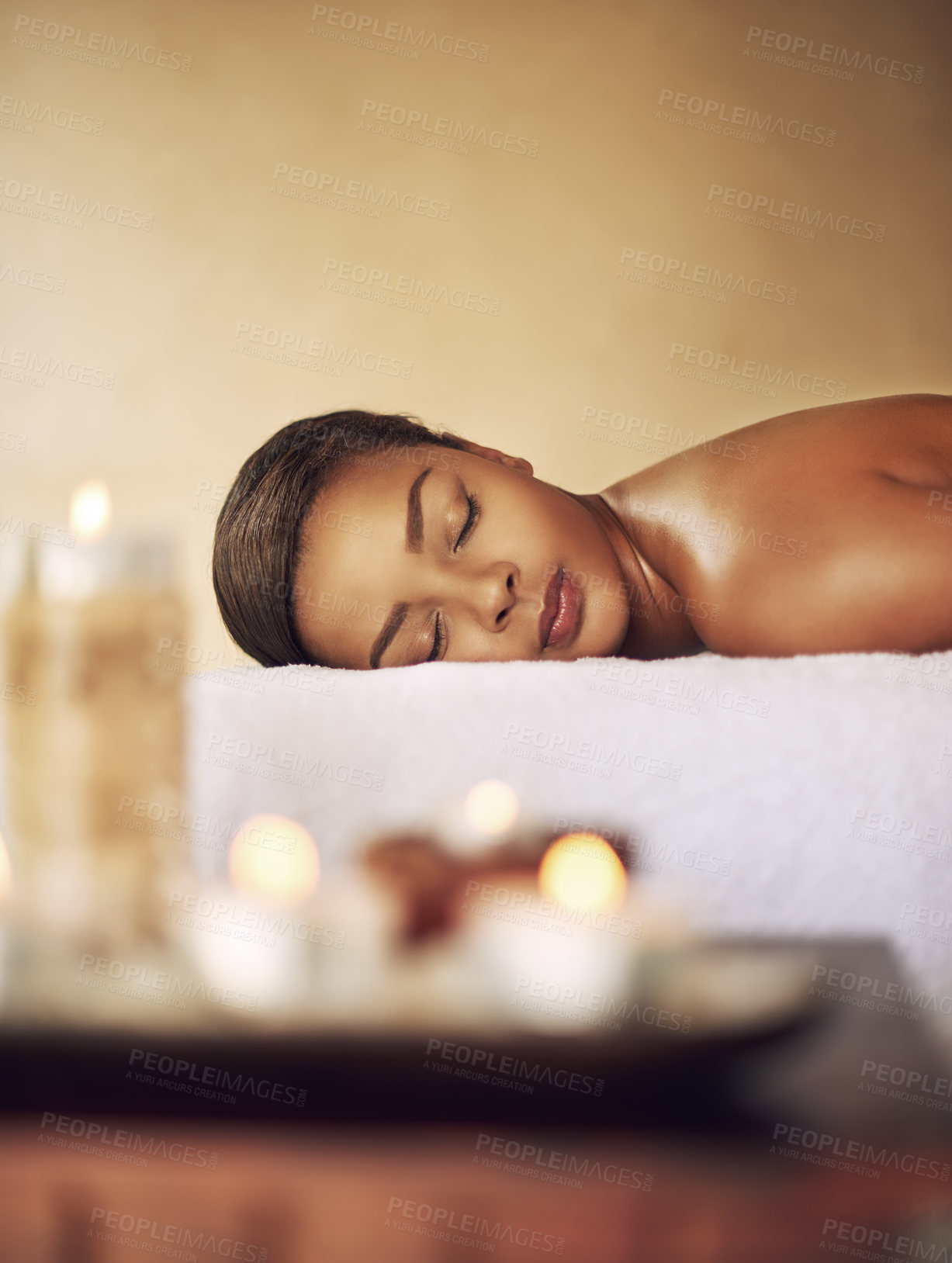Buy stock photo Woman, candles or wax light at a spa for massage, healing or luxury treatment therapy. Female person, wellness or aromatherapy with products for calm, zen or peaceful atmosphere at natural salon