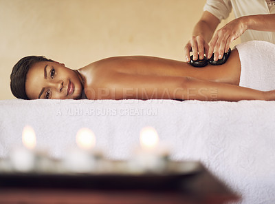 Buy stock photo Cropped portrait of a young woman enjoying some lastone therapy at the spa