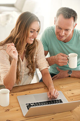 Buy stock photo Laptop, home and happy couple with online news, digital review and check website or application for information. Mature partner, woman or people on computer or pc streaming with coffee for planning