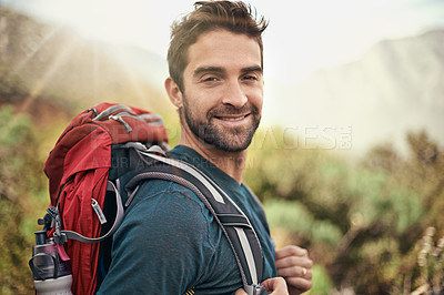 Buy stock photo Hiking, adventure and portrait of man on mountain for fitness, relax and travel journey. Backpack, summer and workout with male hiker trekking in nature path for training, freedom and explore