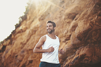 Buy stock photo Man, runner and smile for outdoor workout, sports and nature for cardio or training for marathon. Male person, happy and fitness on mountain for performance challenge, athlete and exercise for race
