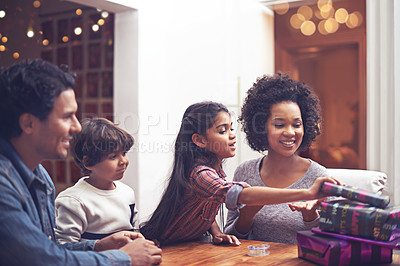 Buy stock photo Parents, children and birthday present in home for celebration gift together, giving or congratulations. Man, woman and daughter with opening parcel in apartment with family connection, love or happy