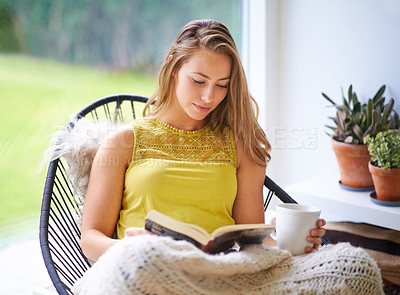 Buy stock photo Reading, book and woman relax with coffee and literature for fantasy novel in home. Peace, story and college student in apartment for studying, education and knowledge for hobby, comfort and lounge