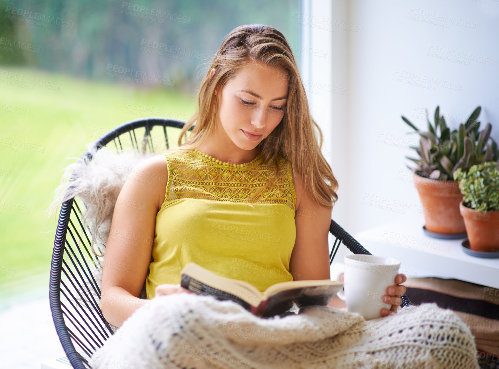 Buy stock photo Reading, book and woman relax with coffee and literature for fantasy novel in home. Peace, story and college student in apartment for studying, education and knowledge for hobby, comfort and lounge