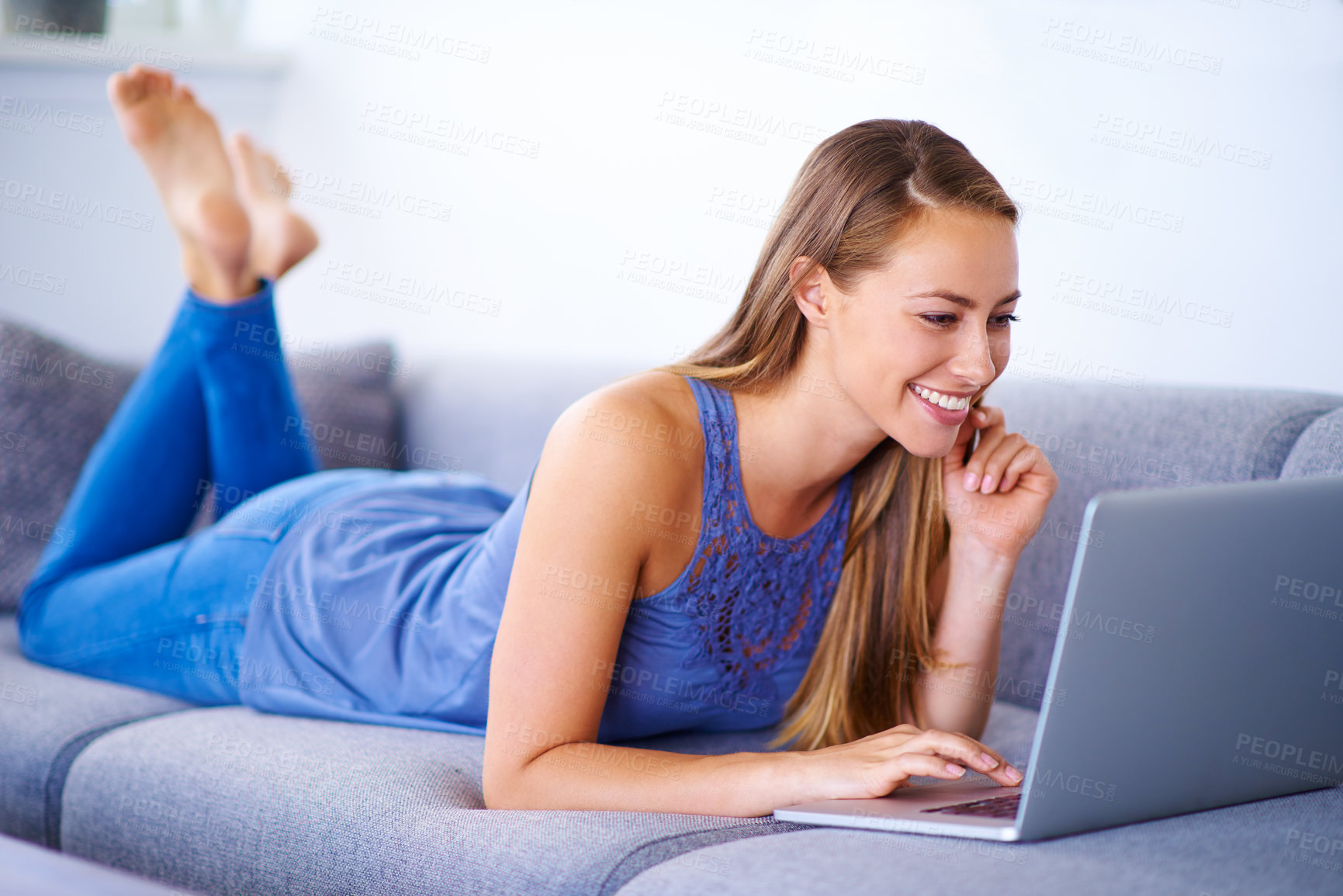 Buy stock photo Woman, laptop and phone call in house on sofa with conversation, chat and communication for gossip. Girl, technology and talking in home with contact or smile for relax, social or planning discussion