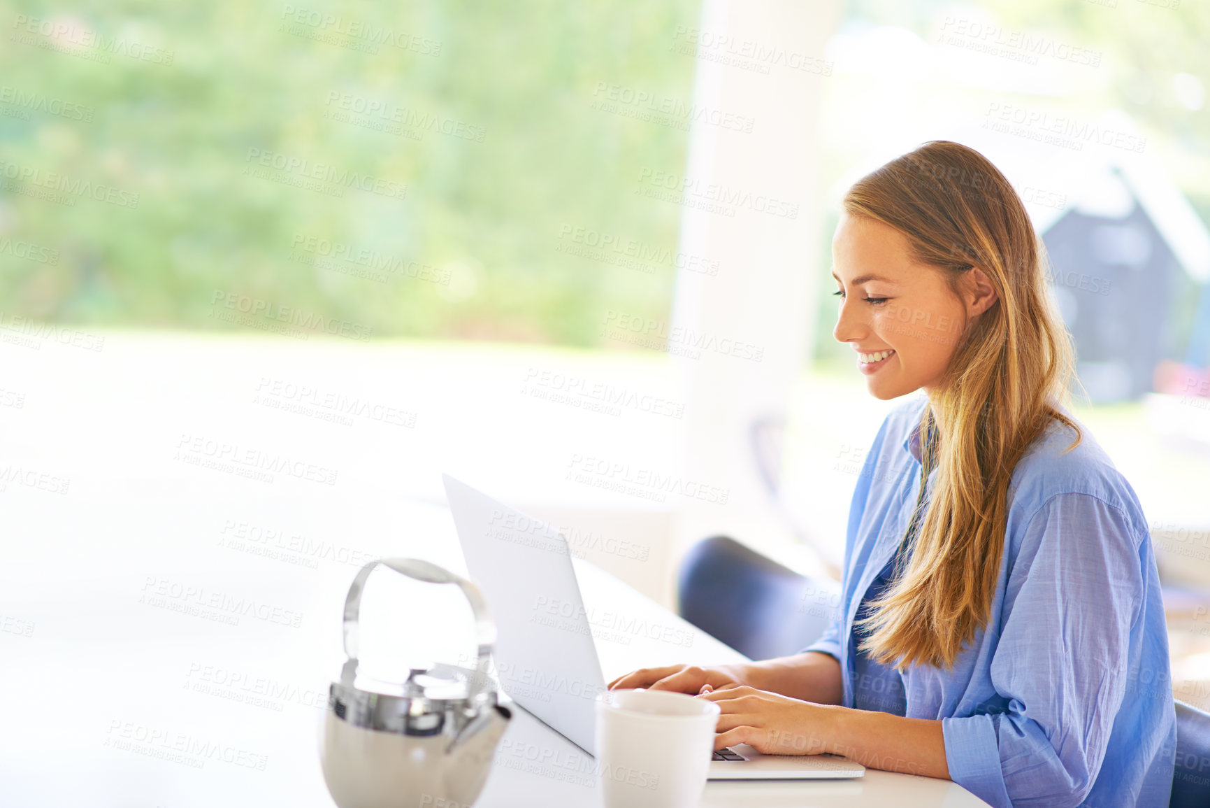 Buy stock photo Happy, woman and laptop on desk typing for communication, email or connection in home. Female person, smile and remote working tech for online research, internet news or reading blog in house