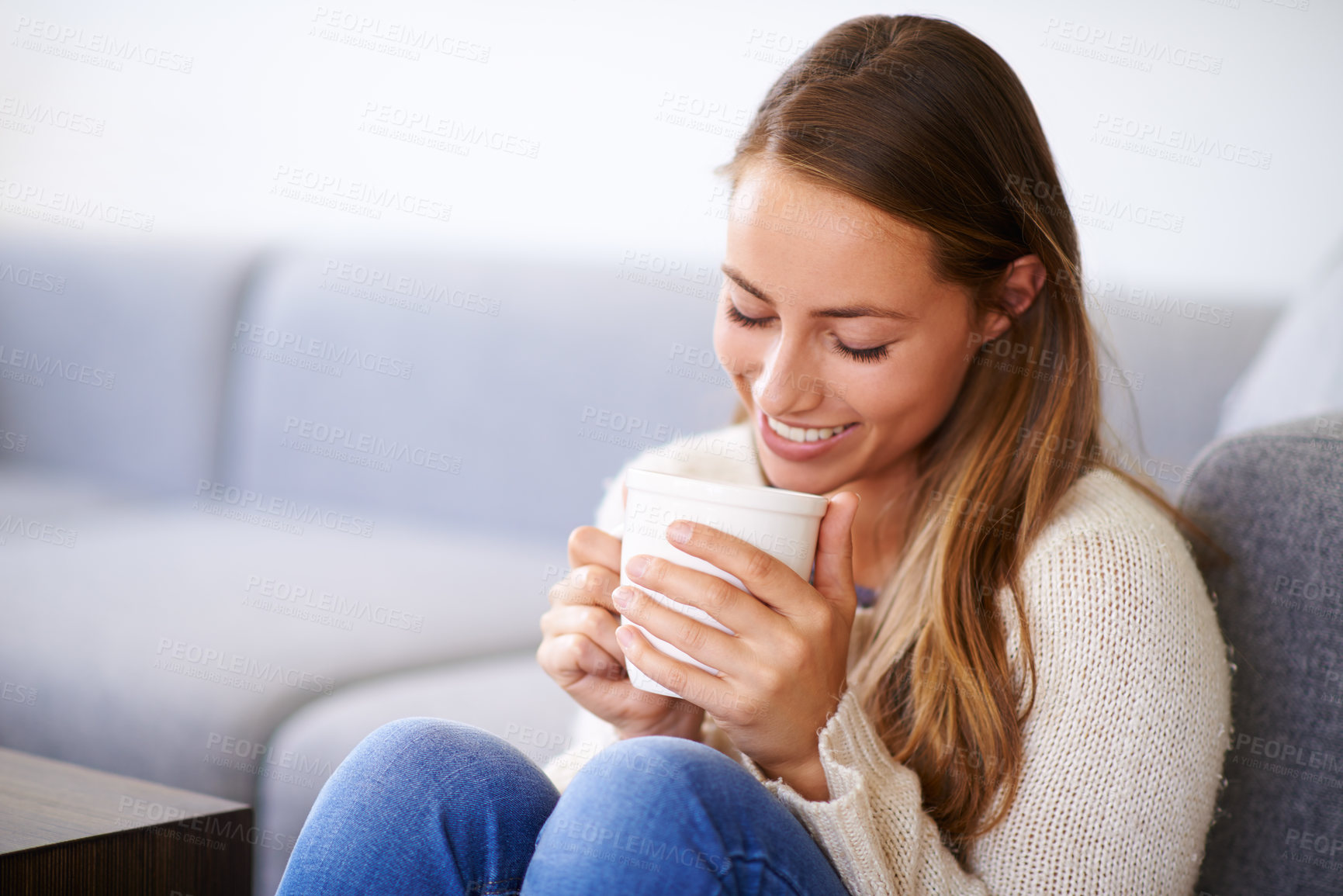 Buy stock photo Happy, woman or coffee in living room for relax, peace or cappuccino in morning. Female person, smile or drink in apartment for wellness, thinking or mug in lounge by sofa for break, rest or caffeine