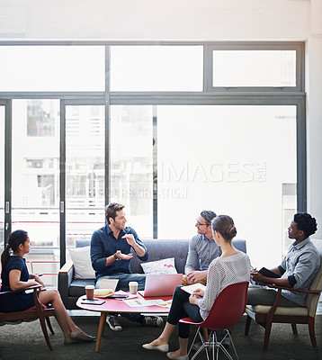 Buy stock photo Shot of a group of coworkers in a meeting in an office