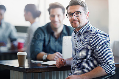 Buy stock photo Portrait of a two colleagues having a talk over coffee in an office in an office