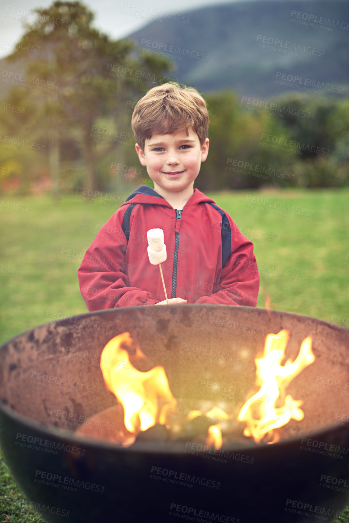 Buy stock photo Boy, fire and portrait in outdoors with marshmallow for roasting on flames for happiness. Camping, bonding and child development with scenic mountain in winter morning with learning in Sweden.