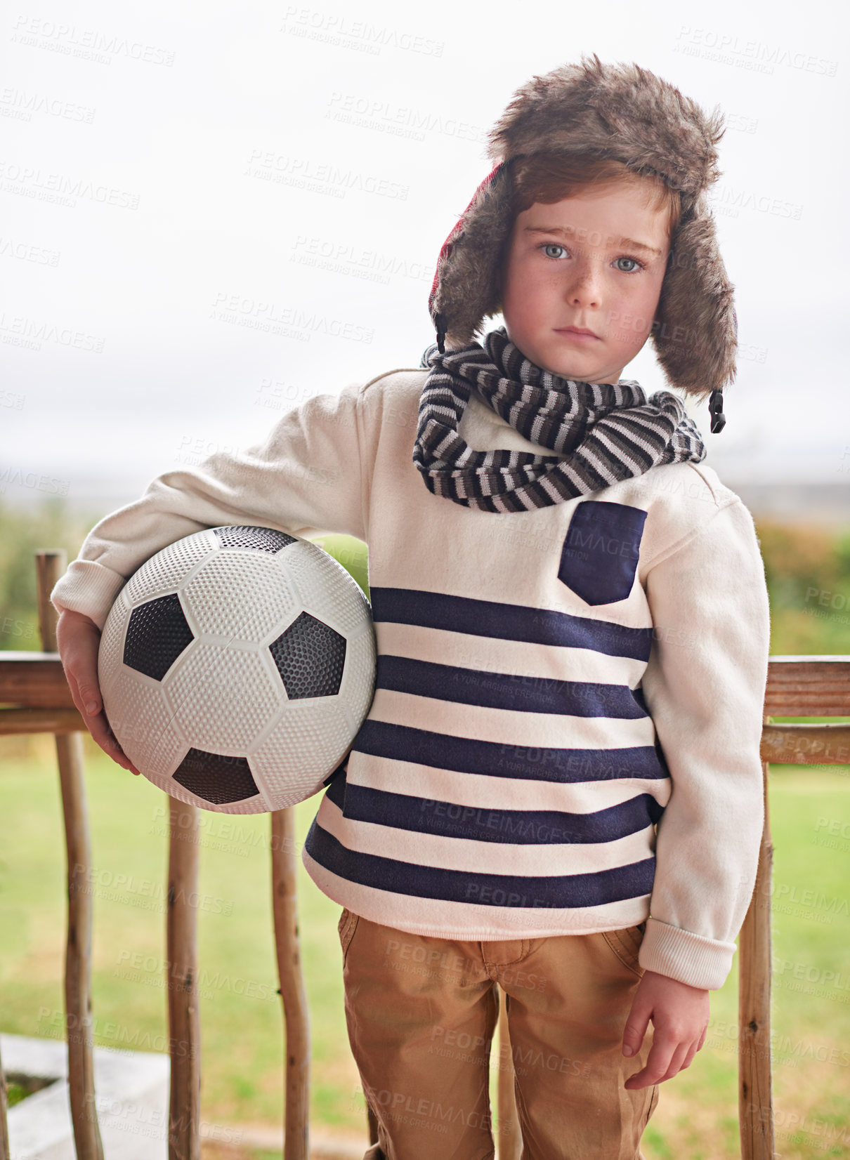 Buy stock photo Winter, portrait and kid with soccer ball outdoor ready for playing, sports or exercise and fitness. Home, boy or young athlete in cold weather with beanie and scarf in England for football practice