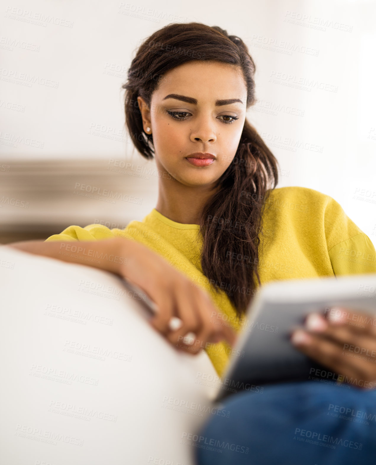 Buy stock photo Relax, reading and girl on sofa with tablet in living room for ebook, story or newsletter subscription. Online, technology and gen z woman for streaming, social media or scroll internet in home