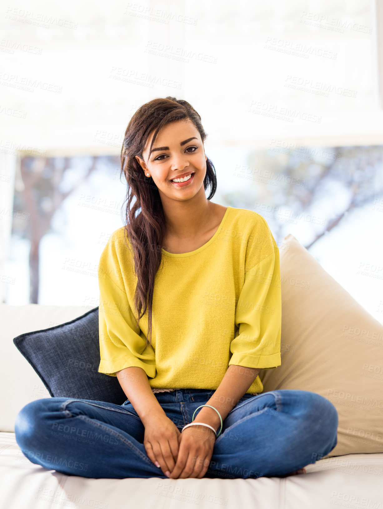 Buy stock photo Black woman, portrait and relax on sofa in home for vacation, calm and break on weekend with pillow. Girl, face and smile on couch in house living room for holiday, peace or comfort with happiness