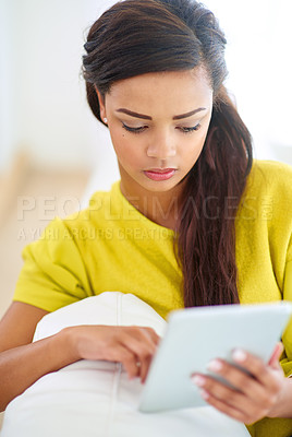Buy stock photo Woman, tablet and home on couch for streaming, fun or online with chat, social media and scrolling. Female person, house and relax for break, communication and internet with tech, typing or browsing