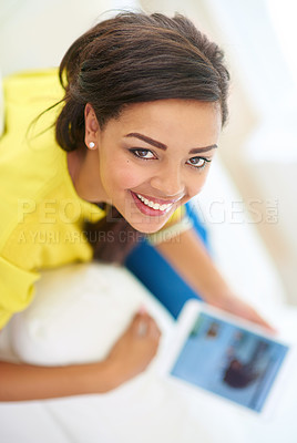 Buy stock photo Woman, tablet and home in portrait for e learning, online gaming and social media on couch. Female person, house and relax for e commerce, streaming and internet with tech, typing or browsing