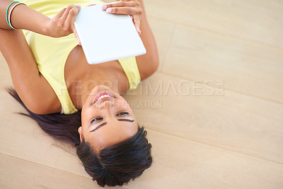 Buy stock photo Female person, tablet and floor with happy for connectivity, streaming or online shopping. Young woman, technology and smile for social media, e learning and gaming in chat for texting or video call
