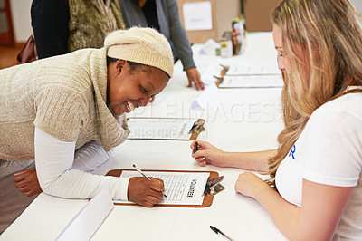 Buy stock photo Cropped shot of volunteer getting signatures for church donations