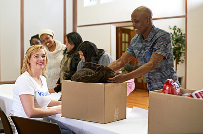 Buy stock photo Cropped portrait of a volunteer collecting donations of clothing