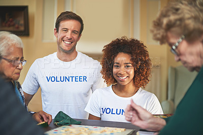 Buy stock photo Portrait of volunteers working with seniors at a retirement home