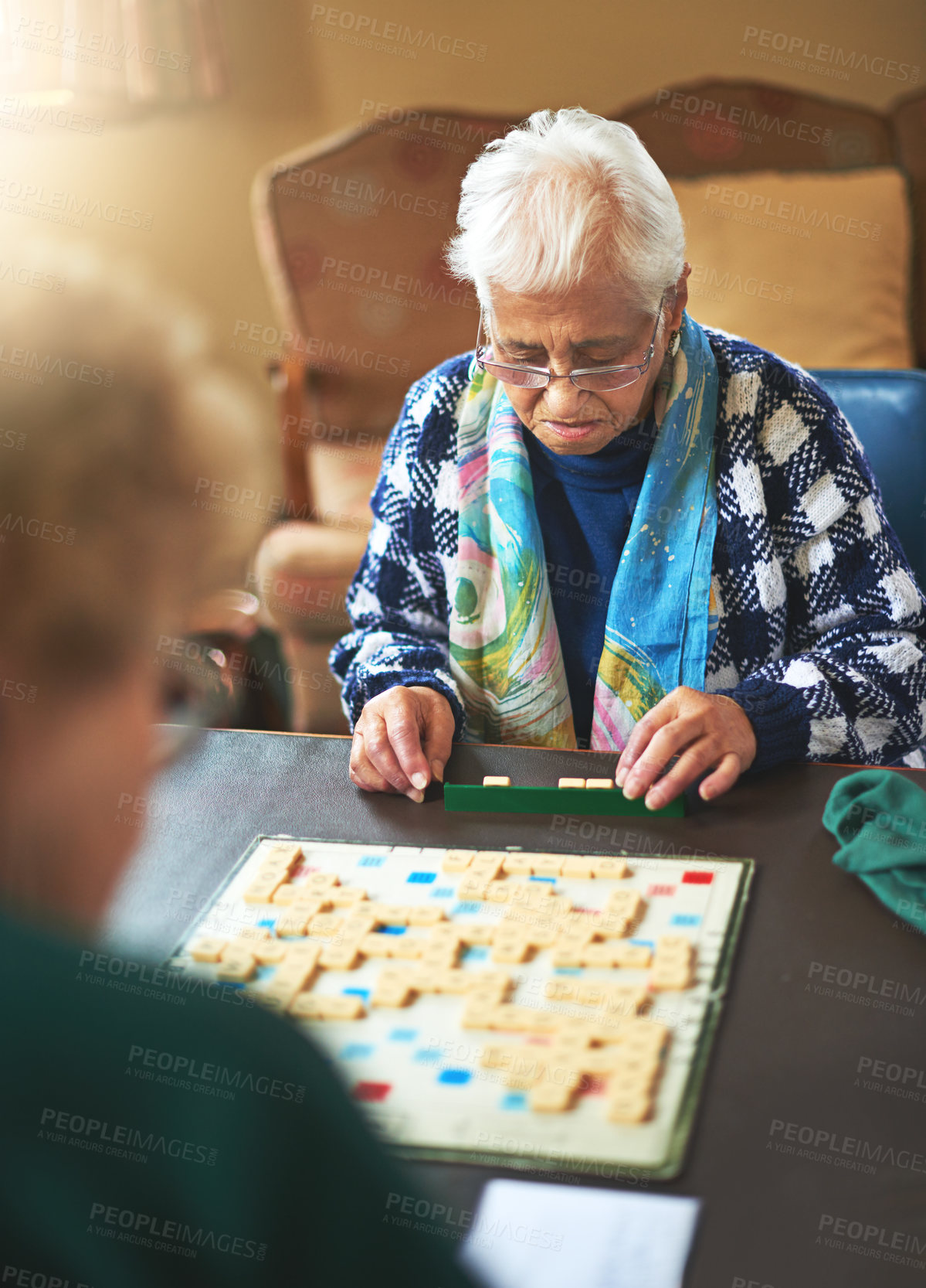 Buy stock photo Board game, senior women and nursing home friendship or old people, thinking and play games together in retirement. Elderly friends, entertainment or hobby or table, retired and assisted living