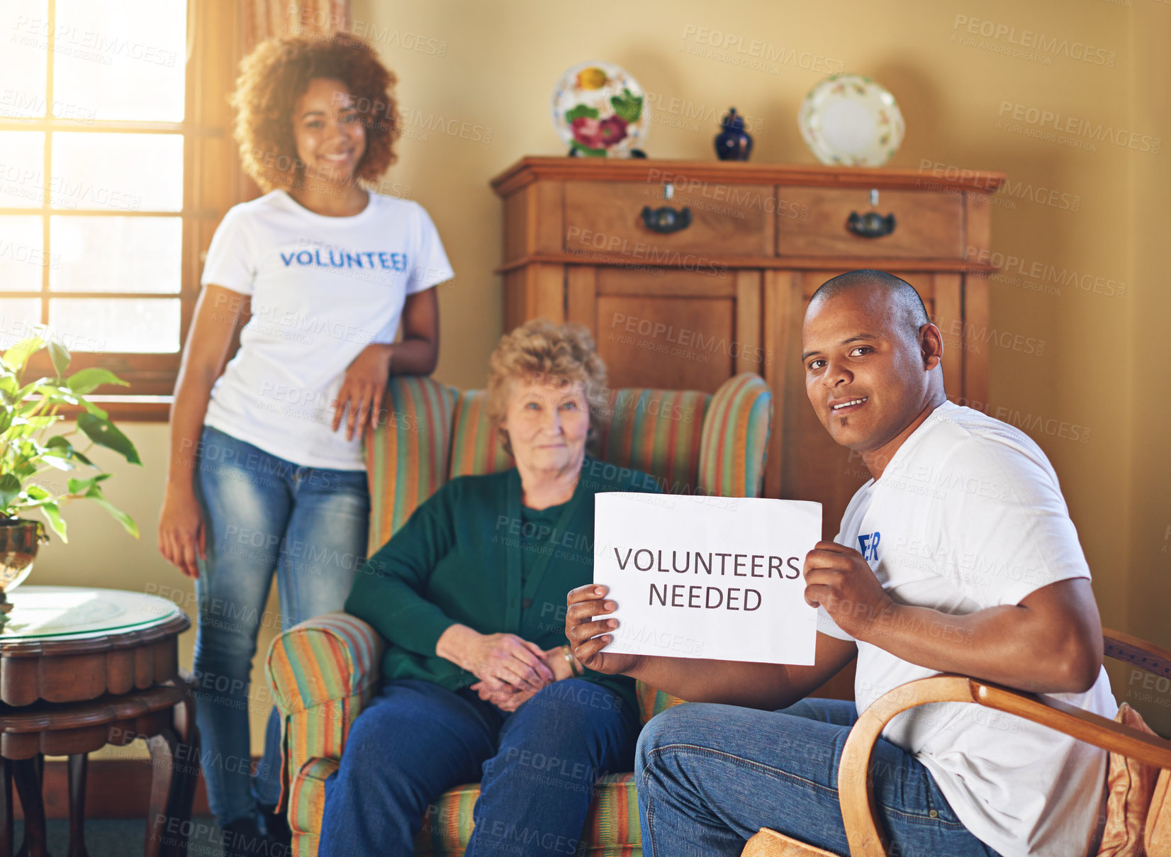 Buy stock photo Shot of volunteer workers at a retirement home