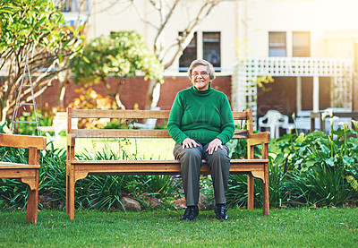 Buy stock photo Portrait of a senior woman sitting on a bench outside