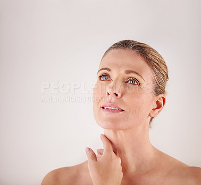 Buy stock photo Thinking, mockup or mature woman with beauty or ideas in studio isolated on white background. Facial treatment, skincare benefits space or natural female model with glow, shine or makeup cosmetics 