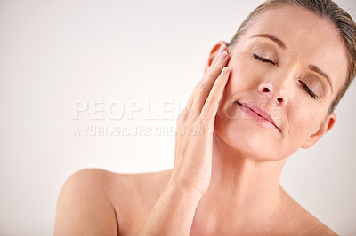 Buy stock photo Senior woman, face and cosmetic wellness or touching her perfect skin on isolated and white background. Mature lady, massaging and wrinkles in facial aging process or skincare and beauty on mock up