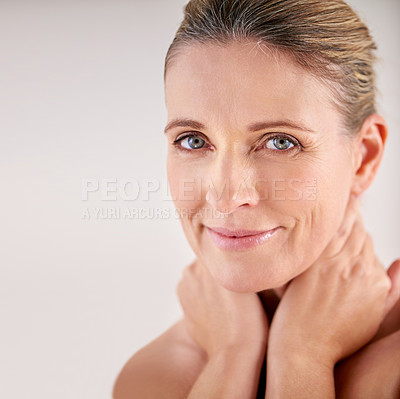 Buy stock photo Cropped portrait of an attractive mature woman posing in studio