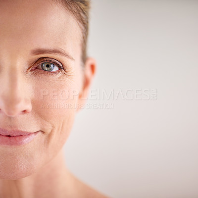 Buy stock photo Cropped portrait of an attractive mature woman posing in studio