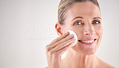 Buy stock photo Mature woman, portrait or cotton for beauty in studio with facial cleaning, cosmetics or skin treatment on mockup. Model, person or swab for face detox, makeup removal or skincare on white background
