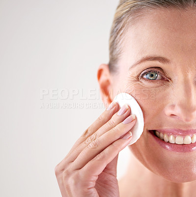 Buy stock photo Senior woman, portrait or cotton for beauty in studio with facial cleansing, cosmetics or mockup space. Model, person or swab for face detox, makeup removal or anti aging skincare on white background