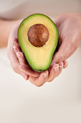 Buy stock photo Hands, avocado and vegetable diet for antioxidants, nutrition and minerals or vitamins for health. Closeup, person and holding vegan food for green detox, superfoods and holding for organic skincare