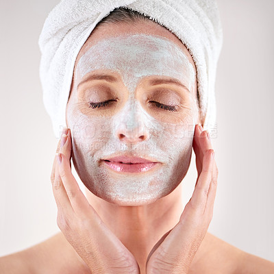 Buy stock photo Spa, mask or woman in studio for facial or skincare routine with natural detox or cosmetics with towel. Model, female person or face with lotion for anti aging treatment or beauty on white background