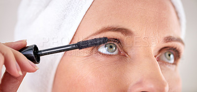 Buy stock photo Makeup, mascara and face of woman with brush in studio for beauty, cosmetics or application. Eyelash, grey background or closeup of female model with eyelashes tool for volume, glamour or aesthetic