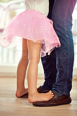 Buy stock photo Legs, feet with father and daughter dance, teaching and learn with music and rhythm at family home. Man, young girl and standing together with activity for bonding, ballet with safety and support