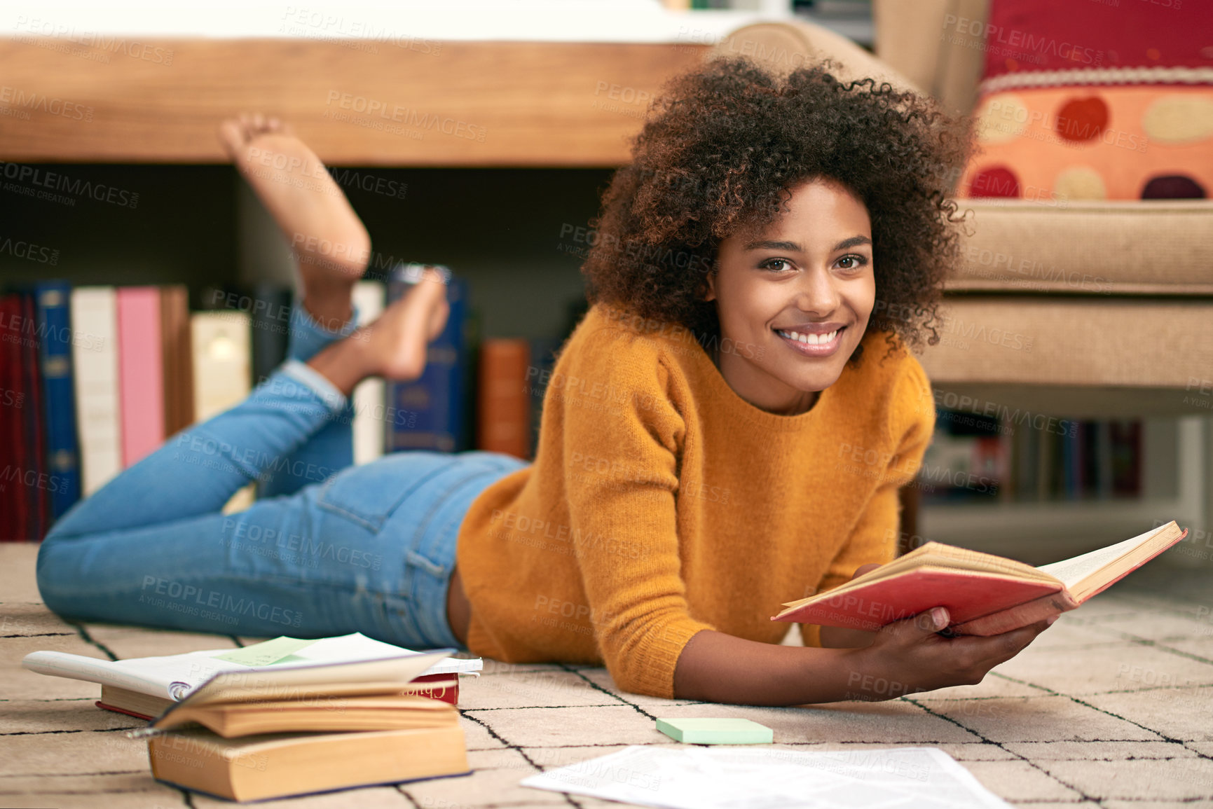 Buy stock photo African woman, novel and portrait on floor in library for  learning, relax and self study for education. Female student, smile and unwind with book or notes for literature or academic knowledge     