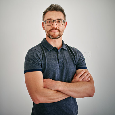 Buy stock photo Man, portrait or confidence with glasses in studio for Immigration, consultant for relocation or migration. Male adviser, backdrop or spectacles for moving to new Zealand with family or friends