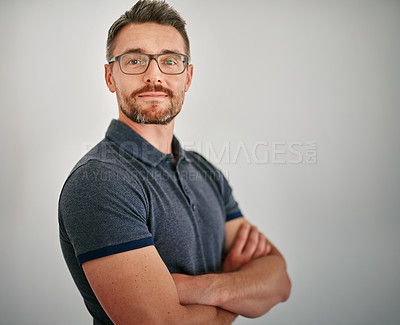 Buy stock photo Businessman, portrait and smile in studio with pride, relax and confidence of employee or designer. Grey background, creative and mature person, staff and worker for startup, company and glasses